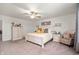 Inviting main bedroom with carpet, natural light, king bed, and soft, neutral decor at 2681 Pumpkin Patch Ln, Indianapolis, IN 46229