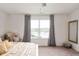 Bright, comfortable bedroom with a view, complemented by soft decor at 2681 Pumpkin Patch Ln, Indianapolis, IN 46229
