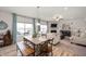 Inviting dining area adjacent to the living room, featuring a rustic wooden table and bench seating at 2681 Pumpkin Patch Ln, Indianapolis, IN 46229