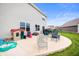 Comfortable patio area with seating, playhouse, and outdoor grill, great for relaxing and entertaining guests at 2681 Pumpkin Patch Ln, Indianapolis, IN 46229