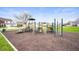 Community playground featuring climbing structures and play equipment at 2681 Pumpkin Patch Ln, Indianapolis, IN 46229
