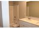 Bright bathroom with dual sinks, granite countertops, and a shower-tub combo at 2704 Grassy Br Dr, Whitestown, IN 46075