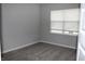 Cozy bedroom with neutral carpet, a window with blinds, and freshly painted walls at 2704 Grassy Br Dr, Whitestown, IN 46075