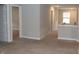 Spacious hallway with plush carpeting and views into other rooms at 2704 Grassy Br Dr, Whitestown, IN 46075