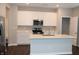 Close-up of the kitchen island, stainless steel appliances, and ample counter space at 2704 Grassy Br Dr, Whitestown, IN 46075