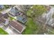 This is an aerial view of a backyard with a deck, gazebo, fire pit, lawn, and detached garage at 304 W 4Th St, Greenfield, IN 46140