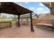 This is a back deck with a gazebo, and the backyard contains a hot tub and garage at 304 W 4Th St, Greenfield, IN 46140