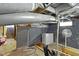 Unfinished basement with a white freezer and painted concrete block walls at 304 W 4Th St, Greenfield, IN 46140