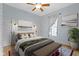 Comfortable bedroom with a cozy bed, stylish decor, ample natural light from the window, and tasteful wall art at 304 W 4Th St, Greenfield, IN 46140
