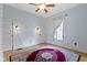Cozy bedroom with original hardwood floors, featuring a large window and convenient closet at 304 W 4Th St, Greenfield, IN 46140