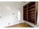 Bright foyer with hardwood floors, built-in shelving, and vintage door at 304 W 4Th St, Greenfield, IN 46140