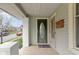 Charming covered front porch with tiled flooring and a classic mailbox detail at 304 W 4Th St, Greenfield, IN 46140