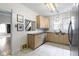 Bright eat-in kitchen featuring light wood cabinetry, stainless steel appliances, and a tile backsplash at 304 W 4Th St, Greenfield, IN 46140