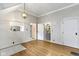 This open living room offers hardwood floors, bright lighting and access to other rooms at 304 W 4Th St, Greenfield, IN 46140