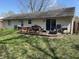 Spacious backyard with a wooden deck, perfect for outdoor entertaining and enjoying the serene surroundings at 3102 Pawnee Dr, Indianapolis, IN 46235