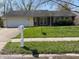 Charming one-story home with a well-manicured lawn and a two-car garage, perfect for suburban living at 3102 Pawnee Dr, Indianapolis, IN 46235