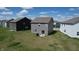 Aerial view of a spacious backyard featuring a patio set, grill, and lush green grass, perfect for outdoor entertaining at 3117 Allesley Way, Westfield, IN 46074