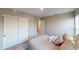 Cozy bedroom with comfortable bed, pillows, closet, and hallway access at 3117 Allesley Way, Westfield, IN 46074