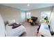 Bedroom with ample light, featuring a bed, desk, and workspace at 3117 Allesley Way, Westfield, IN 46074