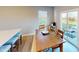 Bright dining area features a wooden table with seating and sliding door access to an outdoor patio at 3117 Allesley Way, Westfield, IN 46074