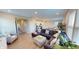 Open-concept living room featuring sleek floors, modern furniture, and a seamless flow to the kitchen at 3117 Allesley Way, Westfield, IN 46074