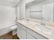 Bathroom features a double sink vanity, toilet, tub, shower, and a large mirror at 3278 Jasper Ln, Brownsburg, IN 46112