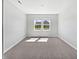 Bright bedroom features neutral carpet, a window with natural light and white walls at 3278 Jasper Ln, Brownsburg, IN 46112
