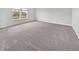Bright bedroom features neutral walls, plush carpet, and a large window with an outdoor view at 3278 Jasper Ln, Brownsburg, IN 46112