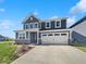 Charming two-story home with a manicured lawn, inviting curb appeal, and attached two car garage at 3278 Jasper Ln, Brownsburg, IN 46112