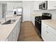 Kitchen with stainless steel appliances, quartz countertops, and white cabinets at 3278 Jasper Ln, Brownsburg, IN 46112