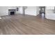 An open-concept living room with light wood floors, a fireplace, and neutral paint at 3278 Jasper Ln, Brownsburg, IN 46112