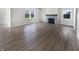 Open-concept living room showcasing hardwood floors, a modern fireplace, and abundant natural light at 3278 Jasper Ln, Brownsburg, IN 46112