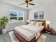 Serene main bedroom featuring a large window, stylish furniture, and contemporary decor at 3278 Jasper Ln, Brownsburg, IN 46112