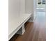 Mudroom featuring bench seating, access to main part of home, and luxury vinyl plank flooring at 3278 Jasper Ln, Brownsburg, IN 46112