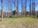 Expansive backyard with mature trees and manicured lawn for outdoor activities at 3559 N Us Highway 41, Bloomingdale, IN 47832