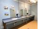 A bathroom featuring multiple sinks, mirrors, and wall decorations at 3559 N Us Highway 41, Bloomingdale, IN 47832