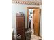 Bathroom with a wood cabinet, toilet and whimsical nature-themed shower curtain at 3559 N Us Highway 41, Bloomingdale, IN 47832