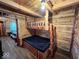Cabin bedroom featuring a unique rustic bunk bed and cozy wood paneling at 3559 N Us Highway 41, Bloomingdale, IN 47832