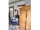 Bedroom with a doorway, wood wardrobe, desk chair and cat pillow on the chair at 3559 N Us Highway 41, Bloomingdale, IN 47832