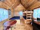 Cabin interior with wood finishes, bunk beds and table at 3559 N Us Highway 41, Bloomingdale, IN 47832