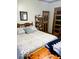 Bedroom with vintage decor and furniture and a display cabinet at 3559 N Us Highway 41, Bloomingdale, IN 47832