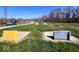 Well-manicured community area with tent, campsites, and volleyball net at 3559 N Us Highway 41, Bloomingdale, IN 47832
