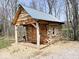 Rustic cabin exterior with a covered porch and detailed wooden accents at 3559 N Us Highway 41, Bloomingdale, IN 47832