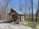 Exterior view of a log cabin featuring rustic wooden accents at 3559 N Us Highway 41, Bloomingdale, IN 47832