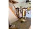 Open concept kitchen with island and adjoining room and wooden staircase at 3559 N Us Highway 41, Bloomingdale, IN 47832