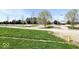 Sprawling green space with mature trees, utility hookups, and gravel pathways at 3559 N Us Highway 41, Bloomingdale, IN 47832
