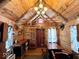 Log cabin interior with wood furnishings, a kitchenette, and rustic decor at 3559 N Us Highway 41, Bloomingdale, IN 47832