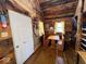 Rustic cabin interior featuring a dining area, bunk beds, and wood accents, showcasing simplicity and charm at 3559 N Us Highway 41, Bloomingdale, IN 47832