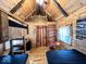 Cabin interior with wood finishes, a bunkbed and table at 3559 N Us Highway 41, Bloomingdale, IN 47832