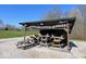 Covered picnic area with multiple picnic tables and rustic chainsaw-themed decor at 3559 N Us Highway 41, Bloomingdale, IN 47832